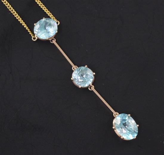 A gold and triple blue zircon drop bar pendant necklace, pendant 2.5in.